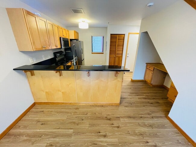 Photo - Top Floor 1bdrm Condo with River Views and Private Deck | Most Utilities & Parking Included! Unidad D5