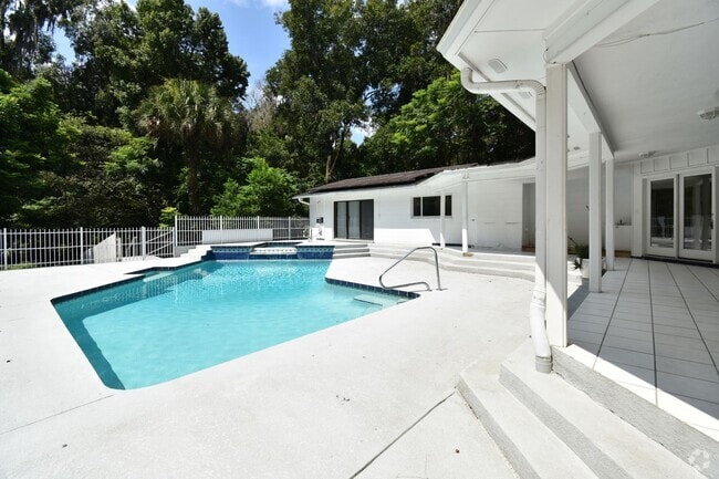 Building Photo - Upgraded 4BR/3.5BA Pool Home in Prestigiou...