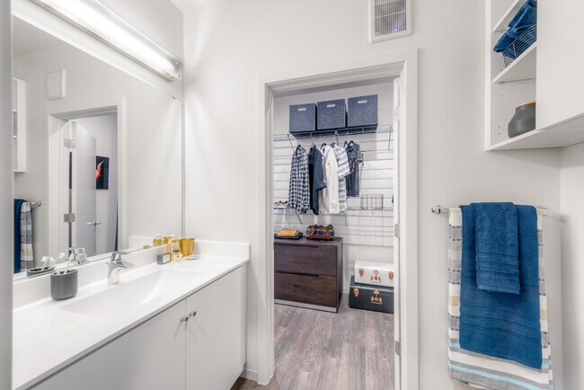 Bath with white countertop and white cabinetry