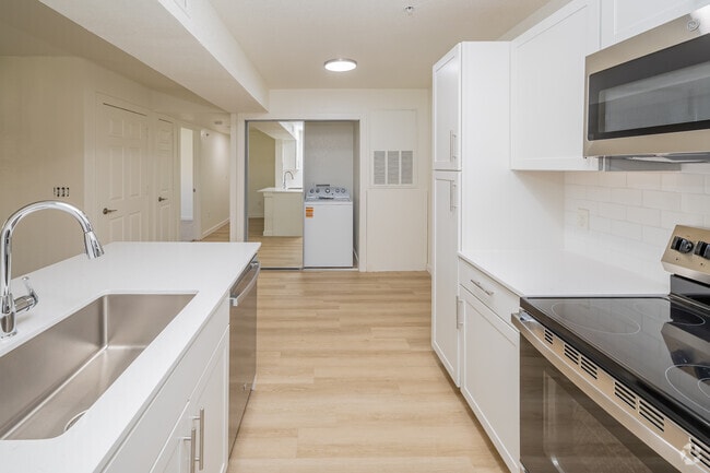 2BR, 1BA - 830SF - Kitchen, Dinning and Laundry Area