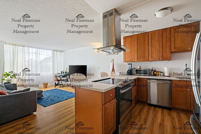 Building Photo - Unfurnished  1 Bed / 1 Bath Condo. 1 assigned covered parking stall. Rent Includes: AC Central, C... Unit 412