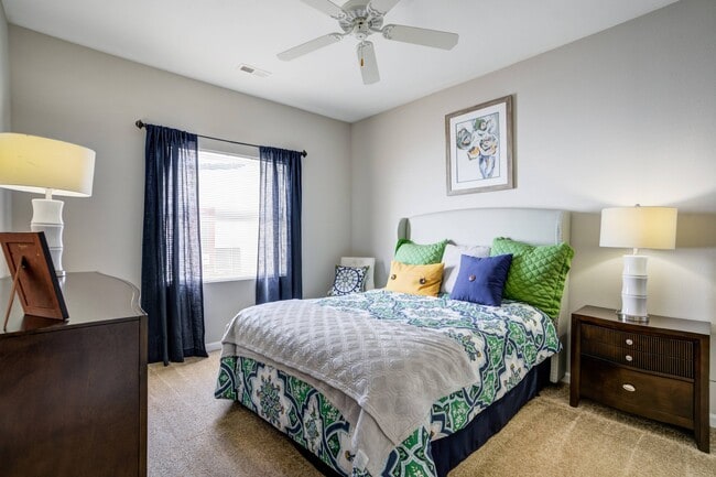 Bedroom with Ceiling Fan - Lenoxplace at Garner Station Apartments