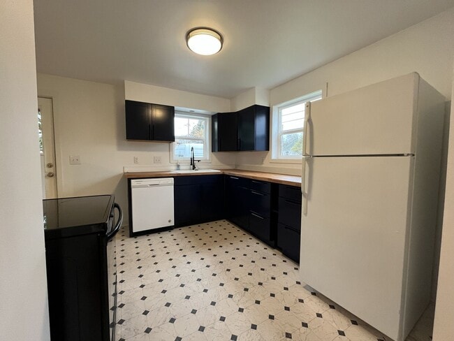 Photo - Charming 2-Bedroom Home with Hardwood Floors, Bright Living Spaces & Large Fenced Yard