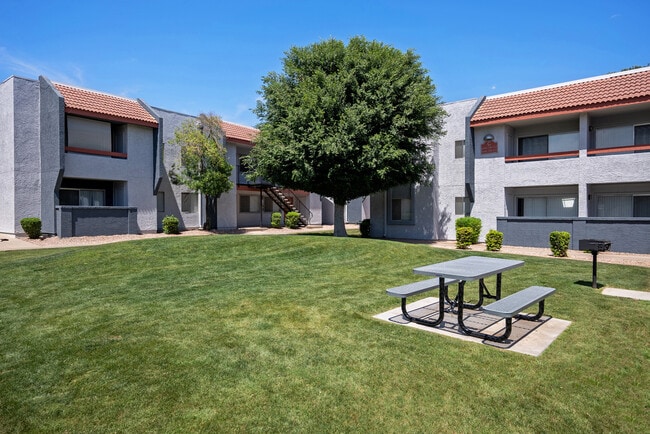 Exterior Building with Outdoor Picnic Area - West 35th Apartments