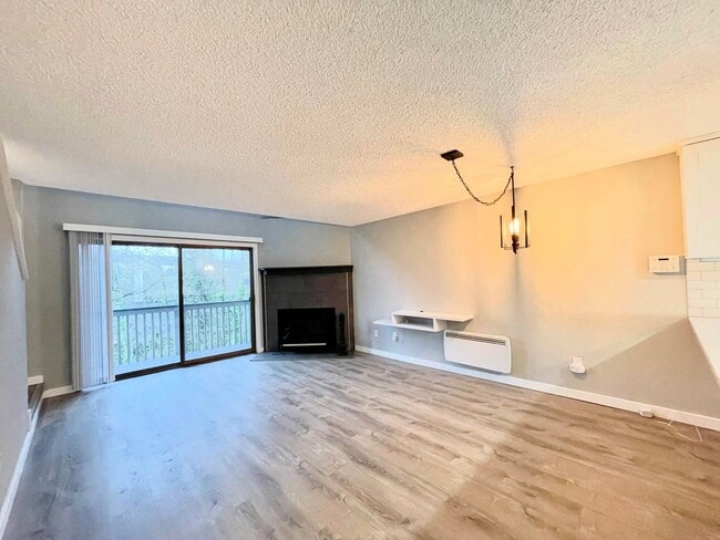 Photo - Charming 2-Bedroom Tukwila Townhome with Garage, Parking, Stainless Steel Appliances & Fireplace ...