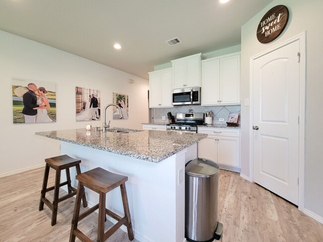 Photo - Experience tranquility in this impressive single-story, three-bedroom, two-bath home in Barton Wo...