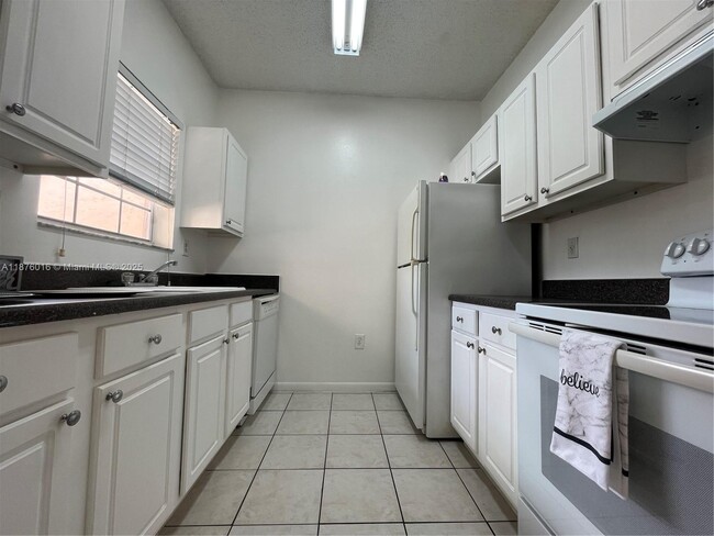 Building Photo - 2451 NW 96th Terrace Unit 21H Rental