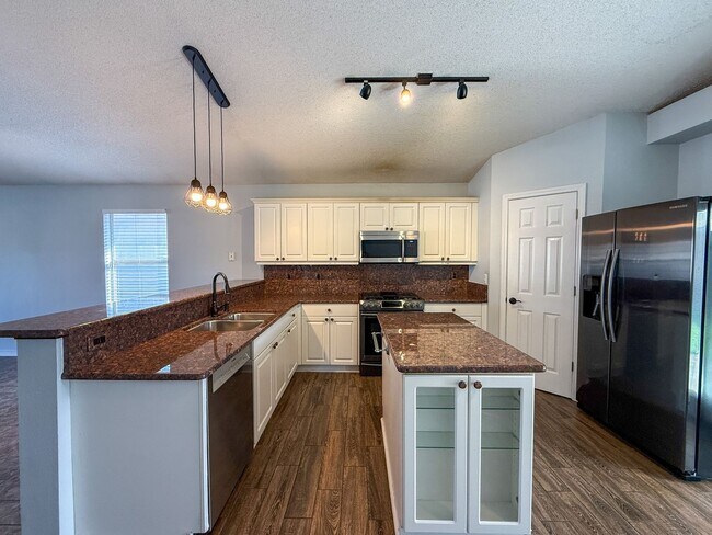 Photo - Charming 3 Bedroom Home with Pergola, Fenced Backyard & Washer/Dryer Included!