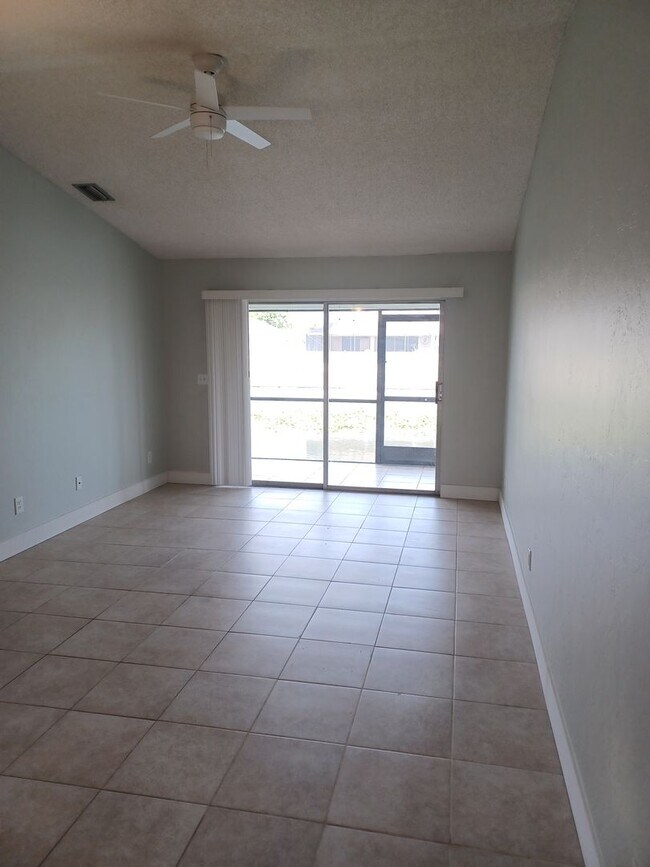 Photo - Community Pool / All Tiled Unit with a screened in lanai / Water Included Unit 913 Gleason Pkwy #2