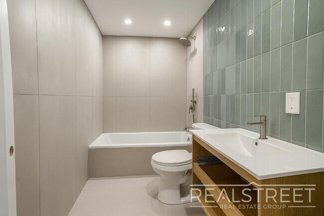 Photo - Spacious 2-Bedroom, 2-Bath Apartment in Bed-Stuy with Modern Amenities