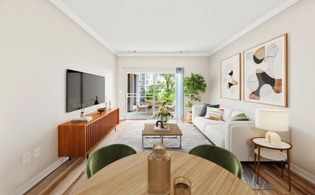 Bright living area with dedicated dining space, private patio access, and an open layout that brings natural light throughout the home.