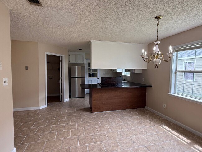 Photo - 3BR/2BA Single-Family Home with Versatile Bonus Room & No Carpet!