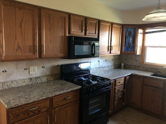 Photo - Affordable Colona Home With 2-Car Garage and Spacious Yard!