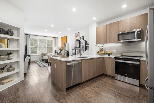 Chef-inspired kitchen with stone countertops and custom cabinetry