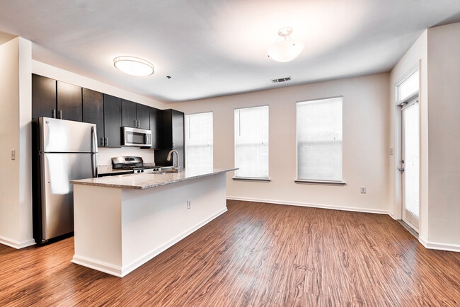 Open-Concept Floor Plans with luxury black walnut vinyl flooring
