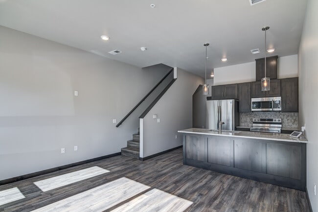 Living Room/Kitchen - River Ridge Luxury Townhomes