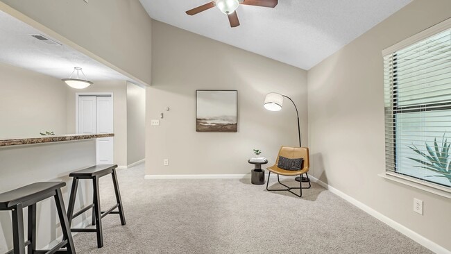 Immerse yourself in the comfort of our substantial living rooms adorned with plush carpeting and a refreshing ceiling fan.