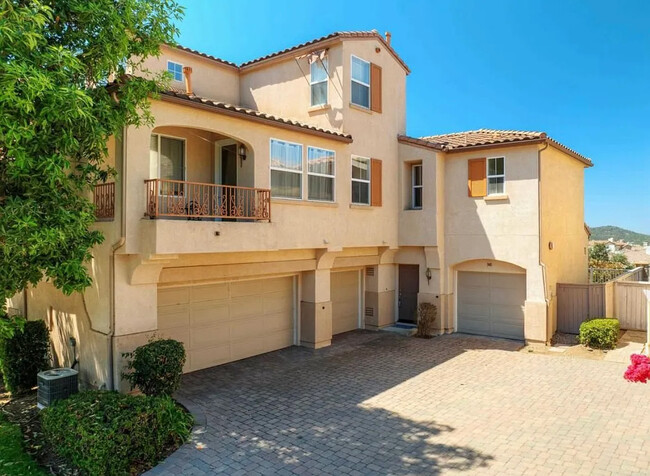 Townhome with 2 attached 1 car garages with ample storage and laundry hookups - 948 Bolex Way Townhome