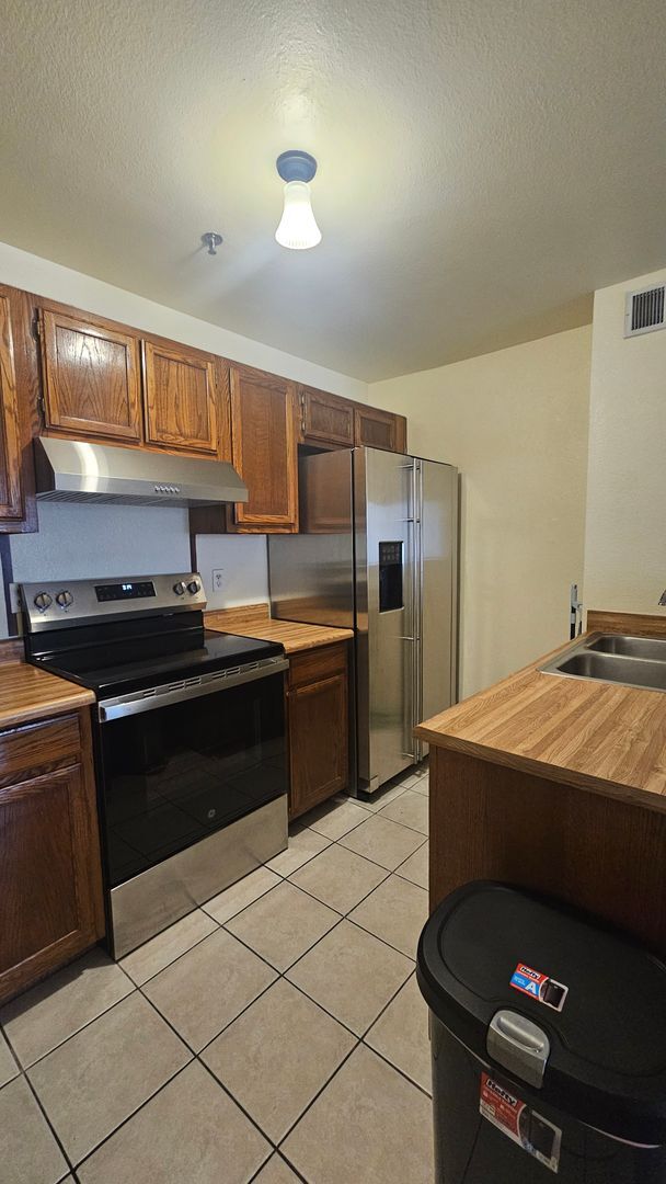 1361 E University Ave. Unit 209