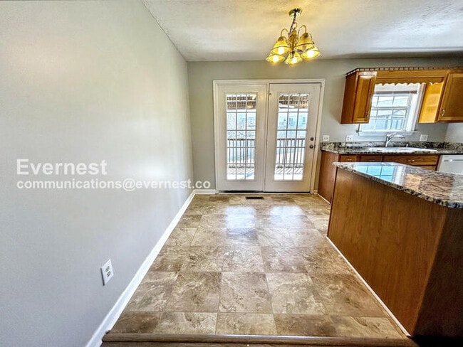 Photo - Spacious 3 Bed, 2 Bath Home with Deck, Patio, and Attached Garage