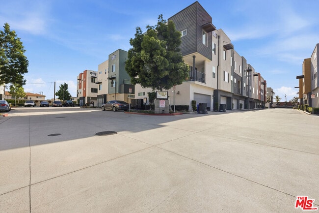 Building Photo - 9942 Artesia Blvd Unit 704