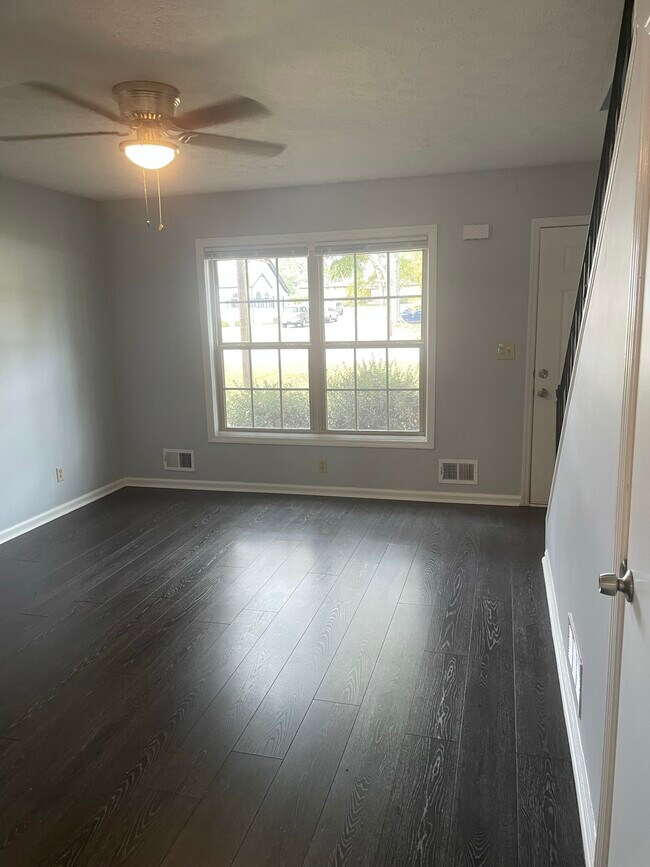 New flooring in the living room and lots of great light! - 808 E Spring St