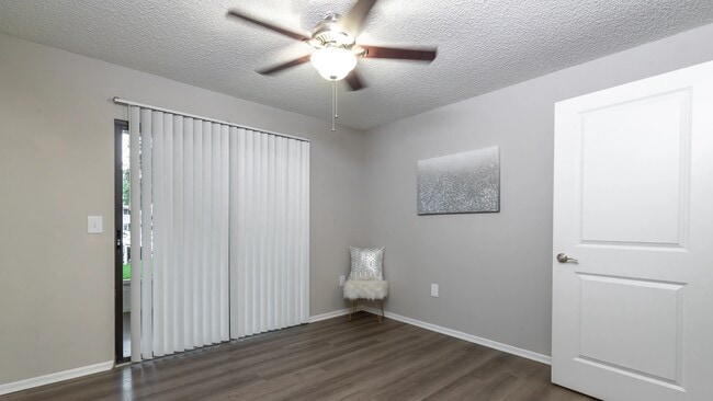 Primary bedrooms, where wood-style floors meet sliding doors to your private patio/balcony – your personal haven.