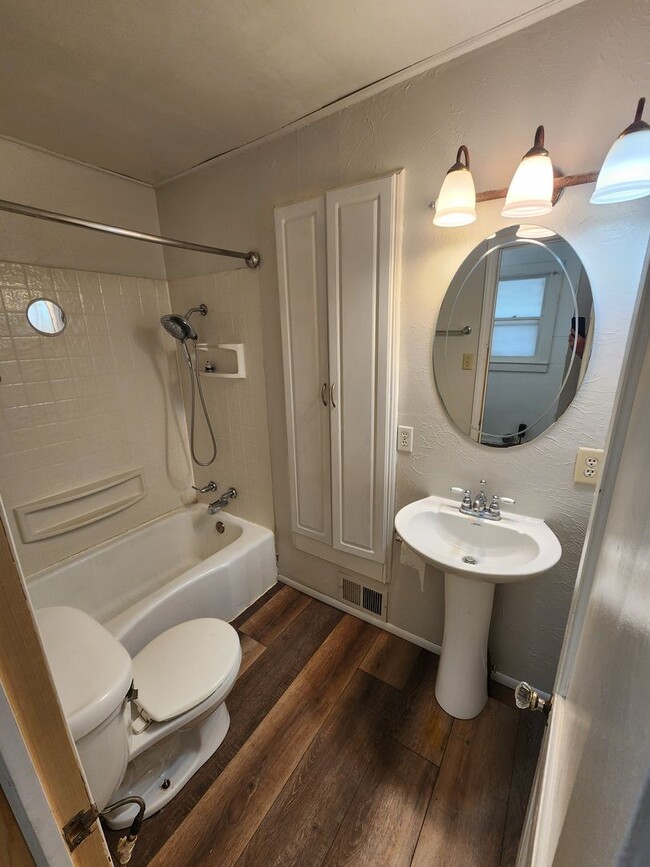 Photo - Nice home with oversized 2car gar with work bench and large shaded yard. Country-like setting