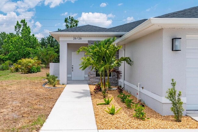 Building Photo - NEW Villa-duplex home with quartz counters, 2-car garage, and a rear patio