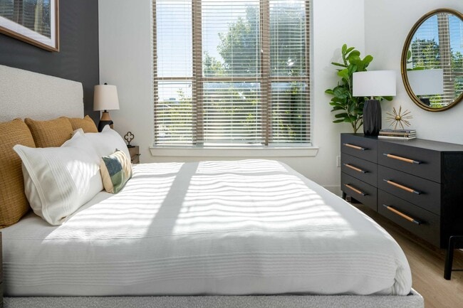 Bedrooms with large windows and ample natural sunlight