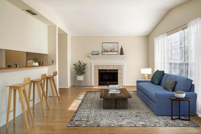 Renovated Package I kitchen and living area with hard surface flooring in common areas