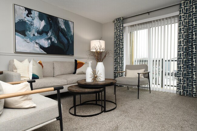 Spacious living room with carpet