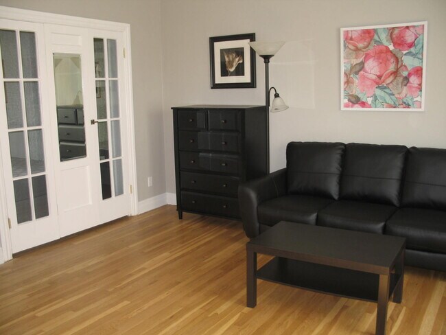 Bed is behind the French doors