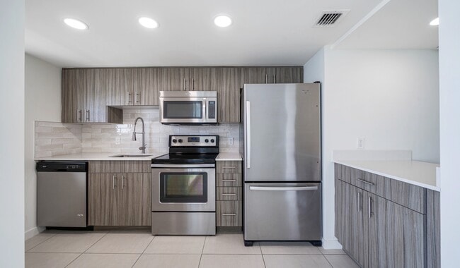 Spacious kitchen with a pantry and granite countertops