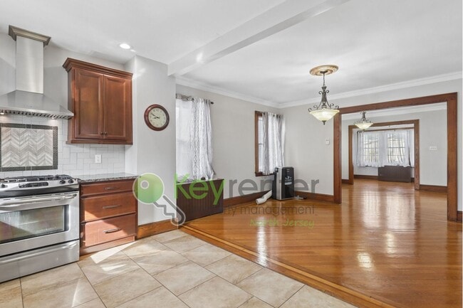 Photo - Spacious 4BR Single-Family Home with Garage, Driveway & Fenced Yard in Kearny