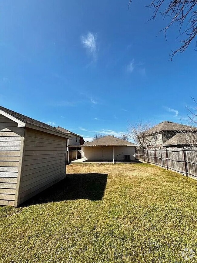 Building Photo - The bright and open living room creates a ... Rental