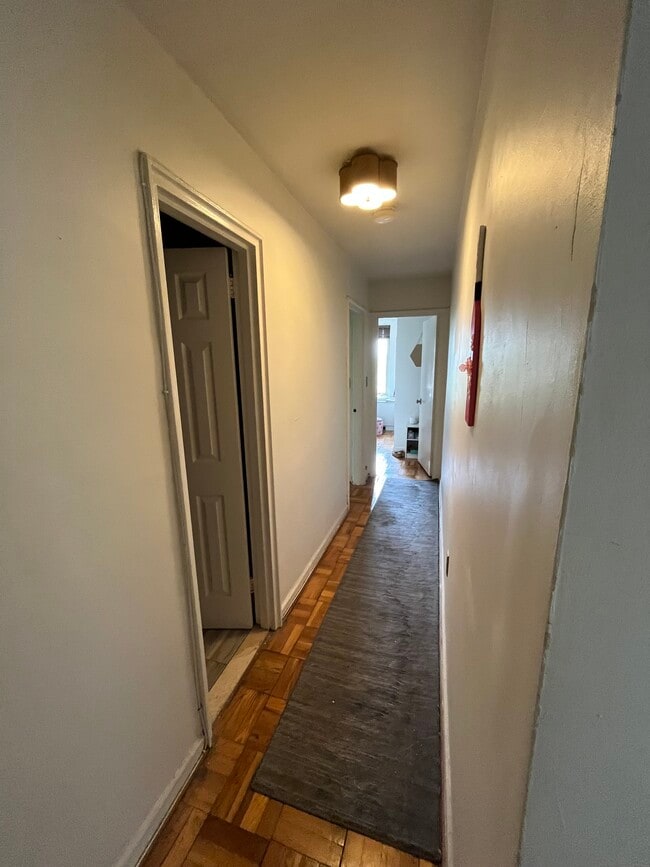 Hall to secondary bath, bedrooms 1 and 2 - 4301 Massachusetts Ave NW Unit 8012