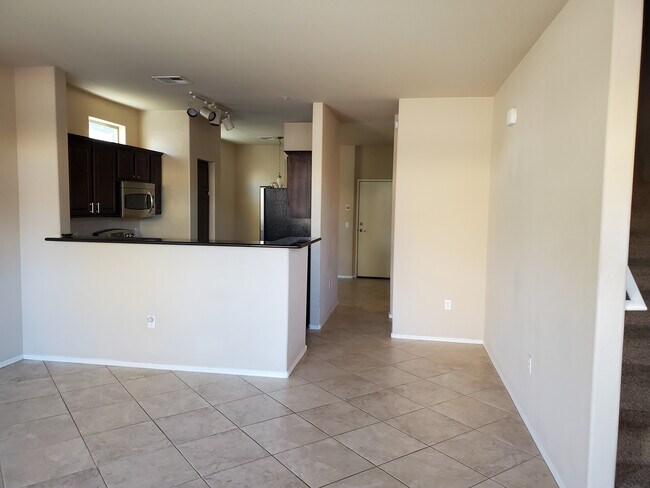 Downstairs -- direct access to garage from dining area (white door) - 17150 N 23rd St