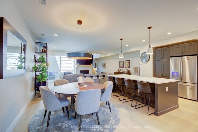 Photo - Evolve Real Estate: Discover Your Ideal Townhome With 4 Beds/4 Baths and Two-Car Attached Garage ...
