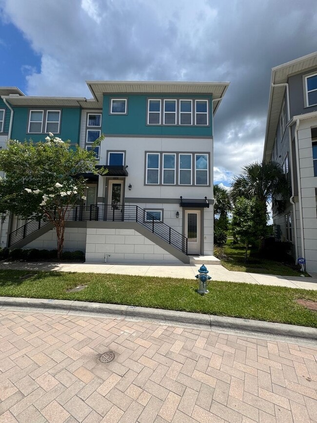 Building Photo - Lake Nona Move-In Special! Save $100/Month | 4 Bed, 3.5 Bath Laureate Park Townhome