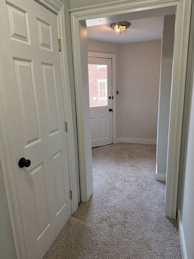 hall to bedrooms, exit - 27 N Main St Unit 27 N.Main St
