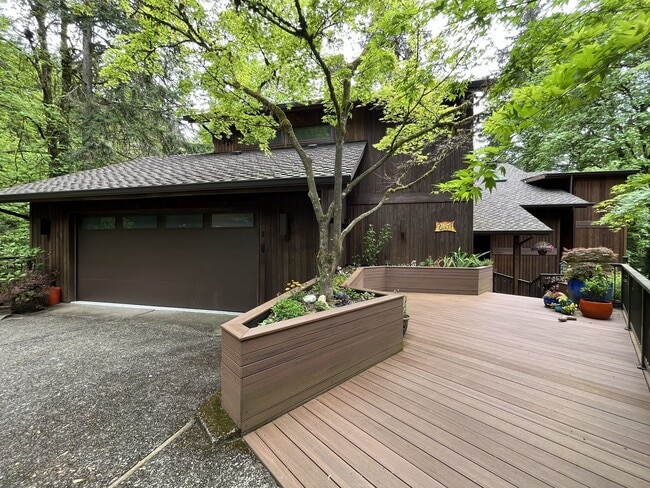 Photo - One-of-a-Kind Custom Home with Wall of Windows, Stone Fireplaces, Expansive Entertainment Space &...