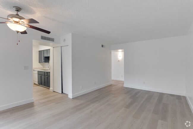 1BR, 1BA - 580SF - Living Room - The Pacifica - 1 & 2 bedrooms units - wash...