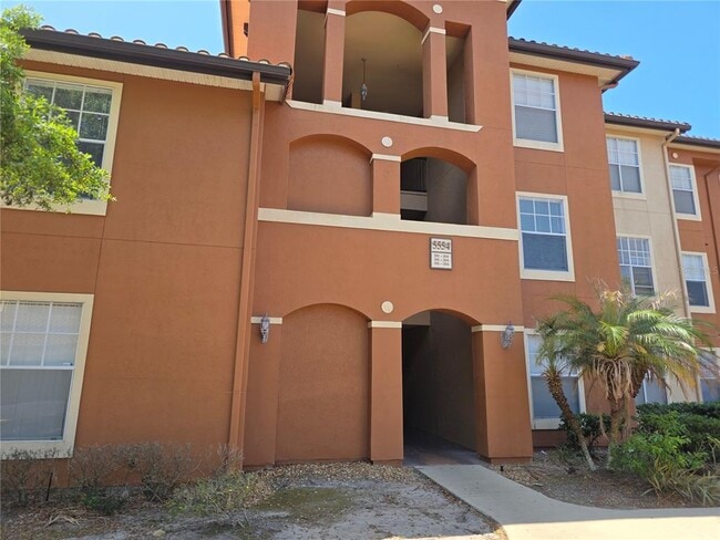 Building Photo - 5554 Metrowest Blvd Unit 202