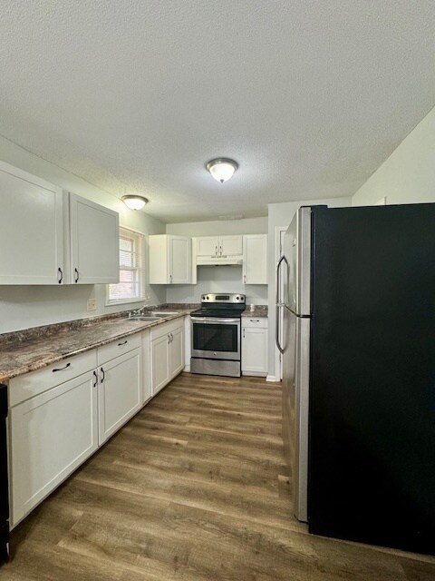 Photo - Spacious 3BR 2BA Home w/ Oversized 2-Car Garage + Stainless Kitchen in Raytown