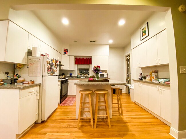 Kitchen with lots of storage and pantry. Island kitchen can seat 3-4 people - 3650 N Oakley Ave Unit 2F