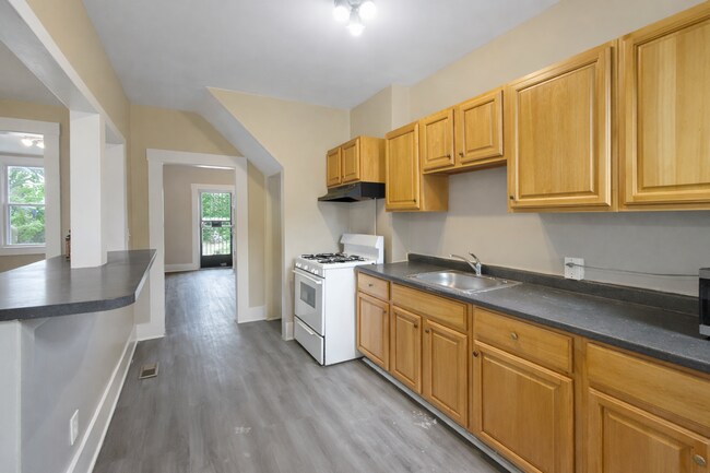 Photo - Modern Finishes, In-Unit Laundry & Bright Living Spaces