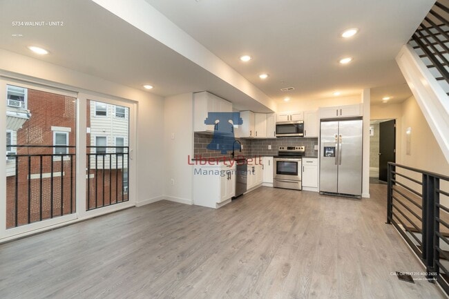 Building Photo - 5734 Walnut St Unit 2