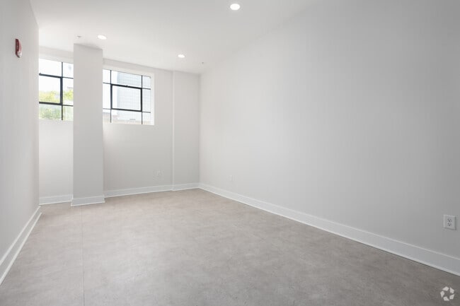1BR, 1.5BA - 652SF - Living Room - Chatham Place Apartments