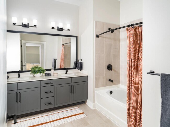 Sophisticated bathrooms at Modera Liberty Row feature dual vanities, sleek finishes, and spacious layouts designed for comfort in Charlotte. - Modera Liberty Row